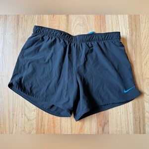 Nike Women's Black Athletic Shorts with Blue Swoosh